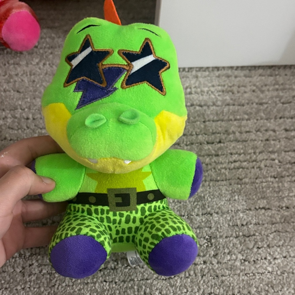 Green and Purple Stuffed Dinosaur Toy